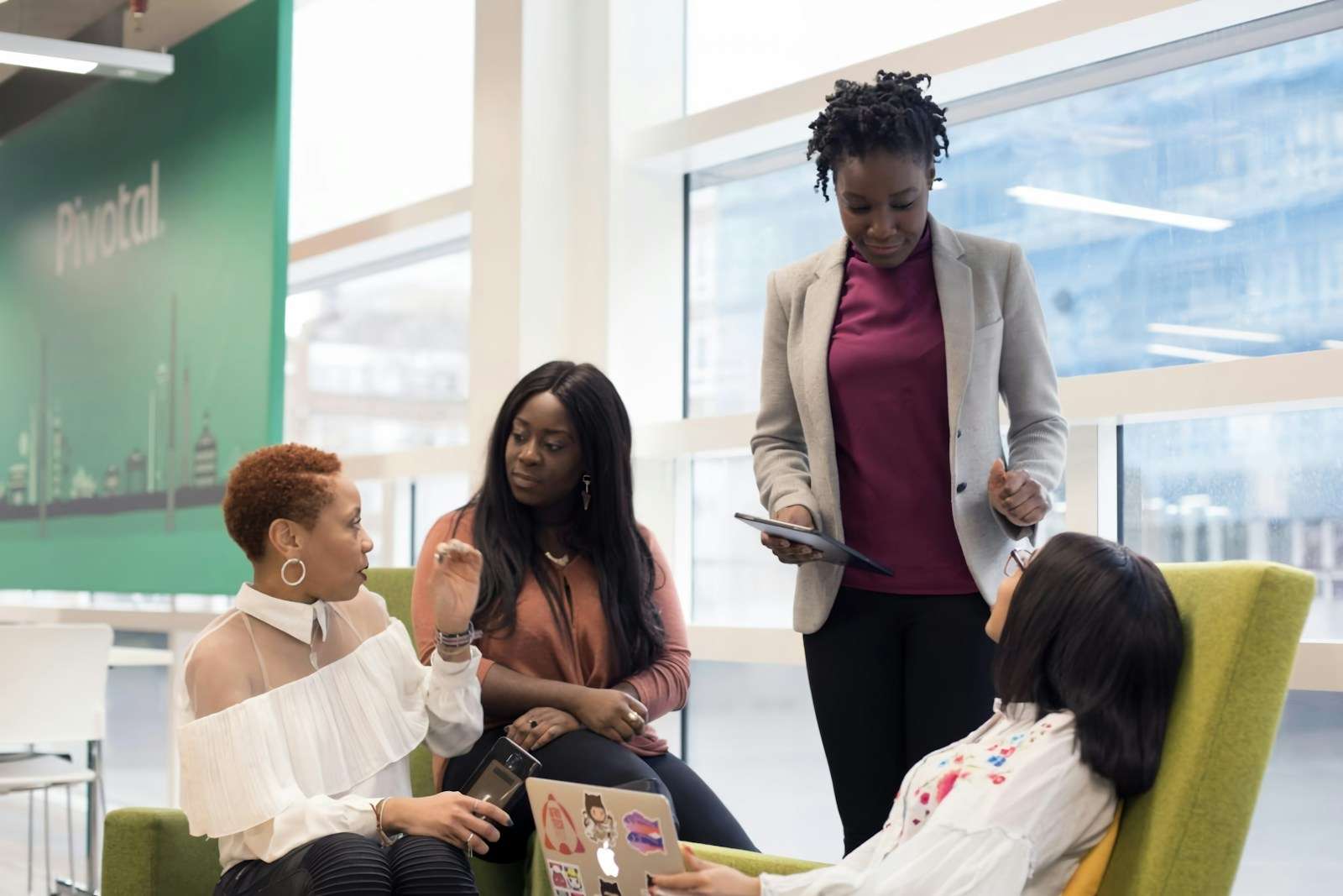 Photo by UK Black Tech a group of women sitting around each other